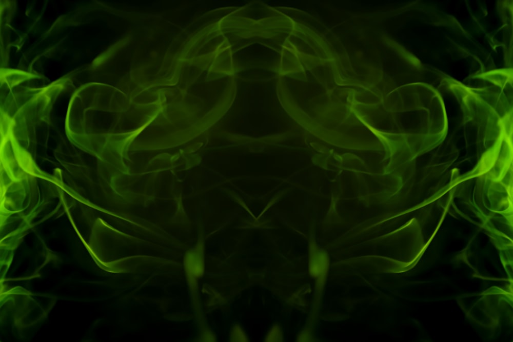a picture of green smoke in the dark