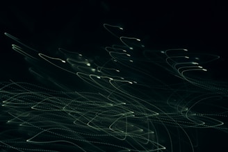 Abstract light trails swirling over a dark background, evoking rhythm and movement.