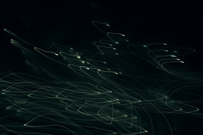 Abstract light trails representing energy and creative movement in motion.