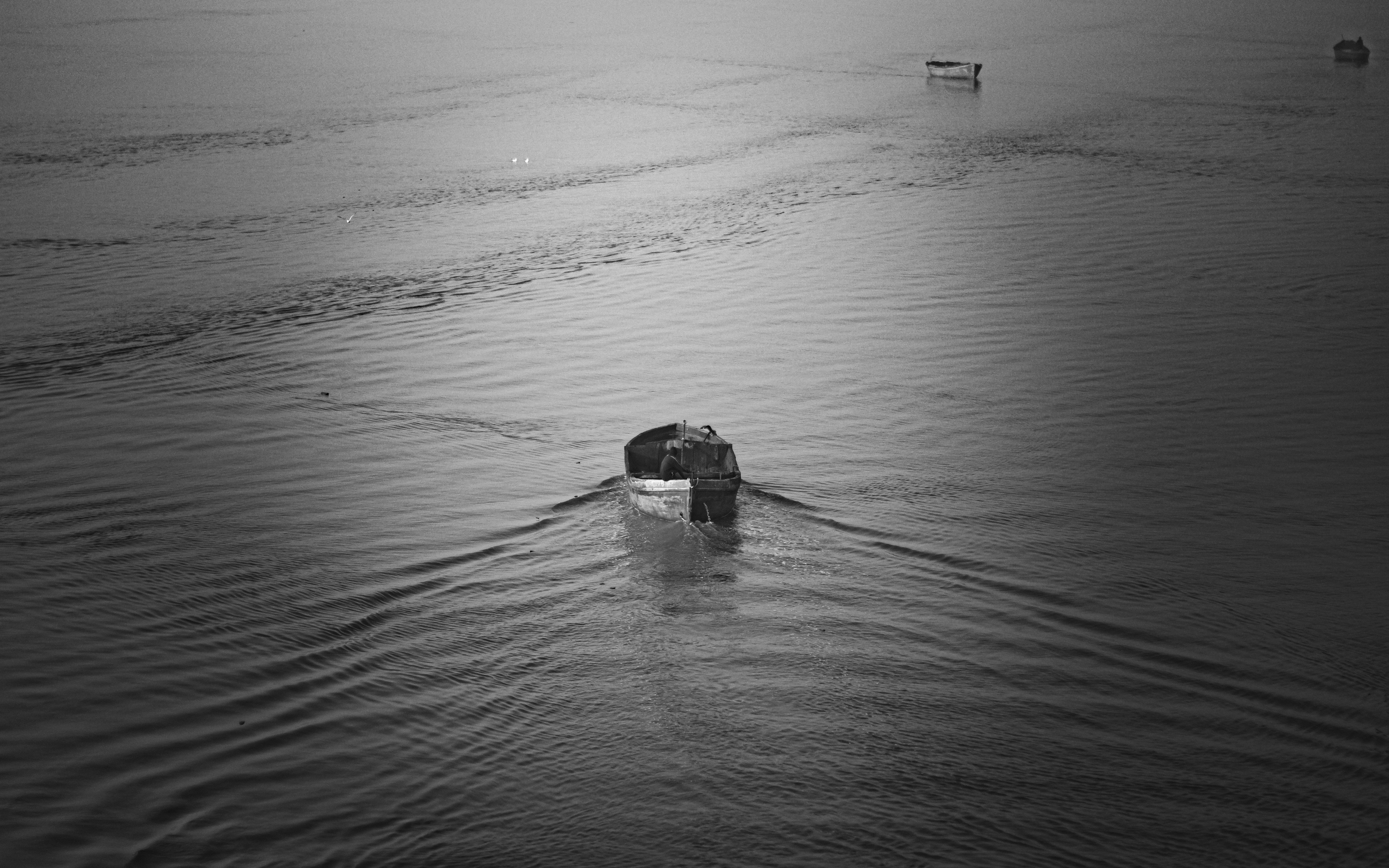 a boat floating on top of a body of water