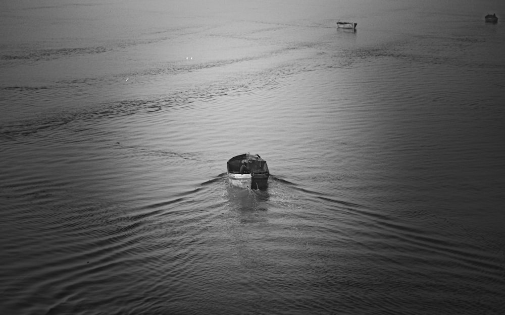 a boat floating on top of a body of water