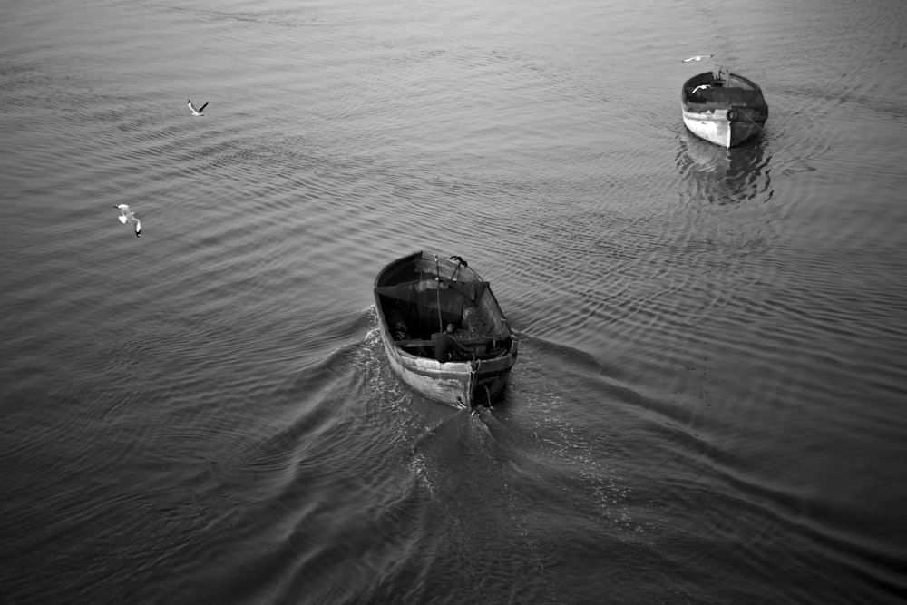 two boats in a body of water near each other