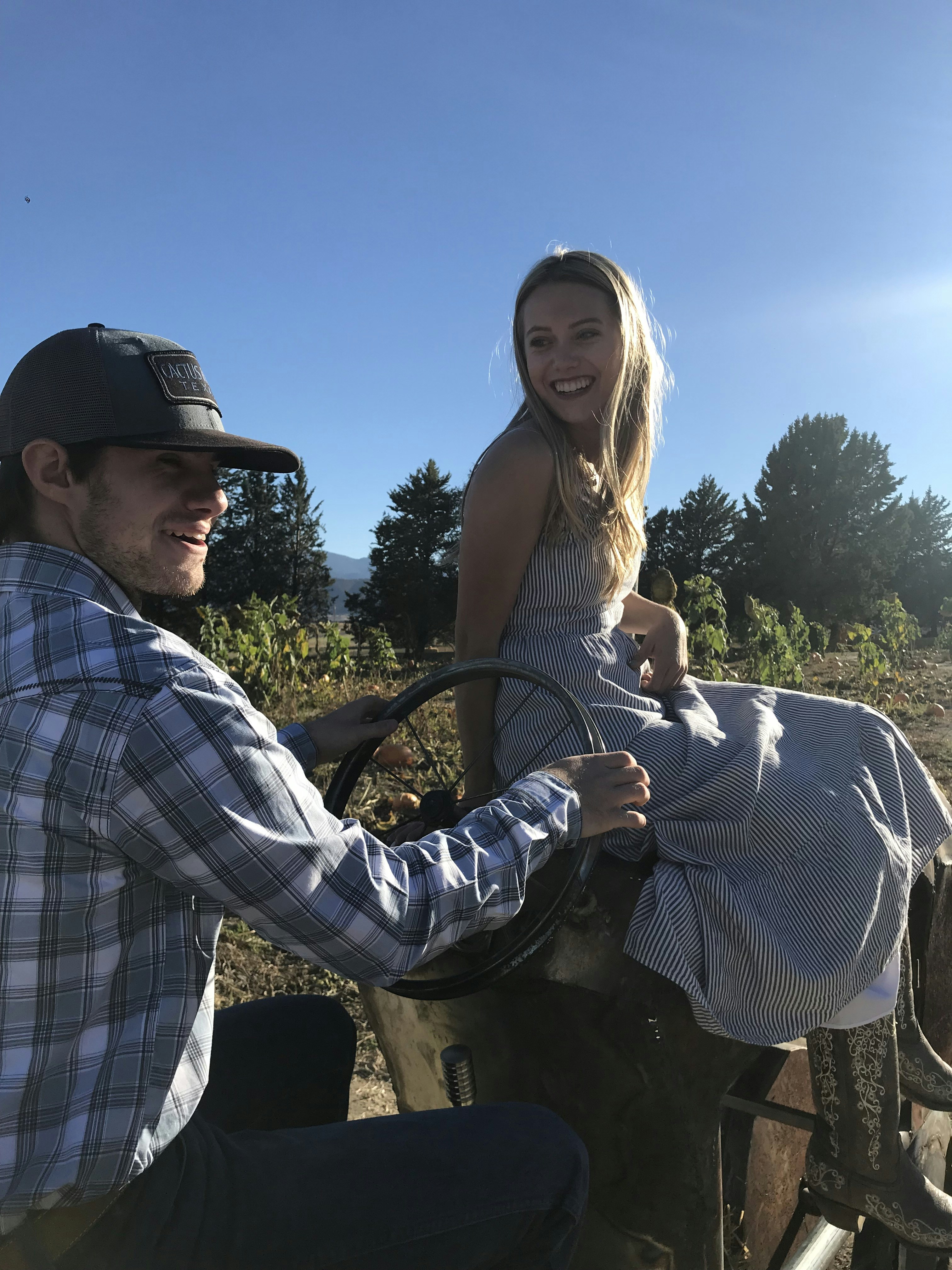 a man and a woman riding on the back of a horse