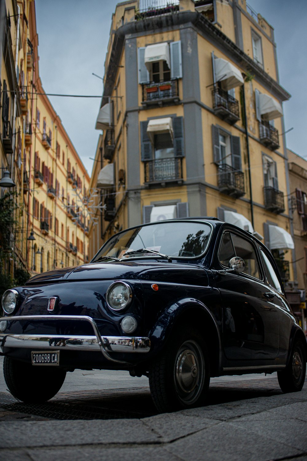 a small car parked on the side of the road