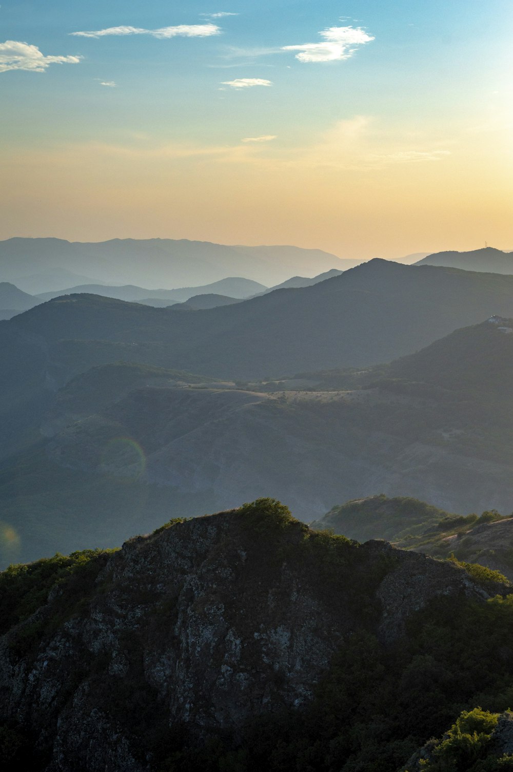 a view of a mountain range at sunset