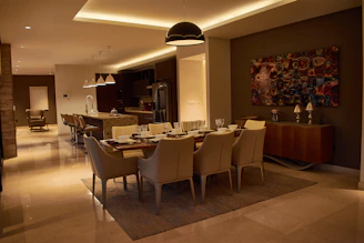 a dining room with a table and chairs