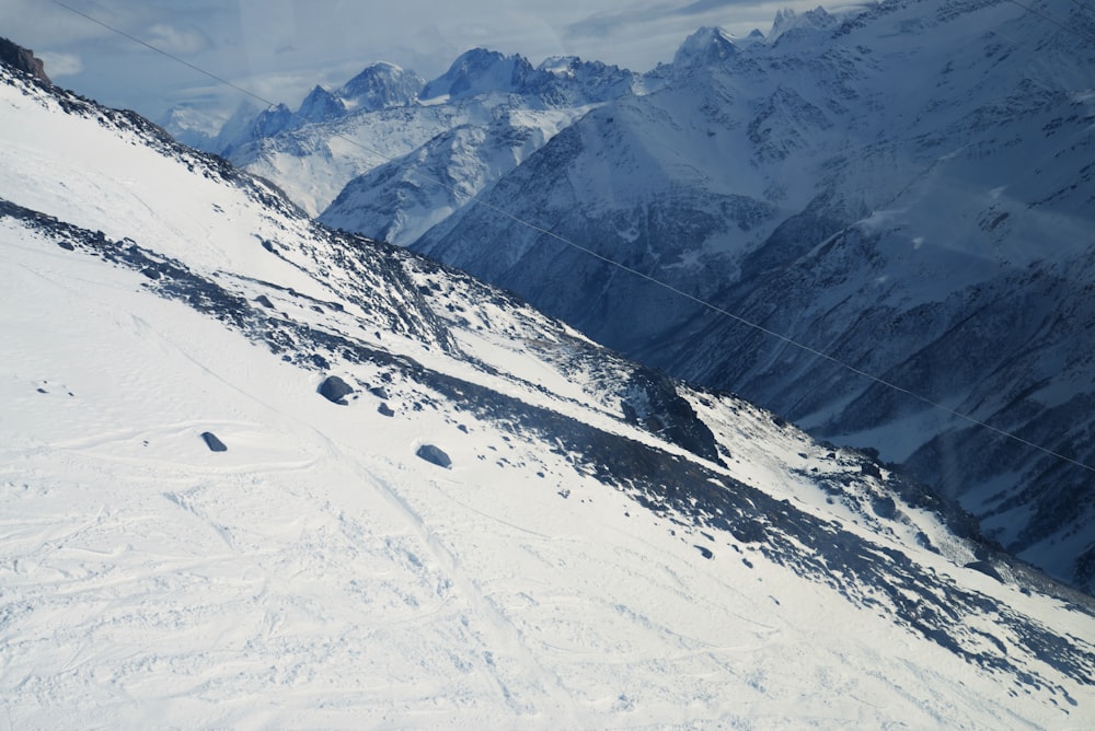 a person riding skis down a snow covered slope