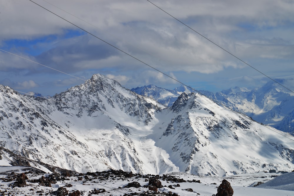 a person standing on a snow covered mountain