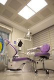 a dentist chair in a room with a skylight