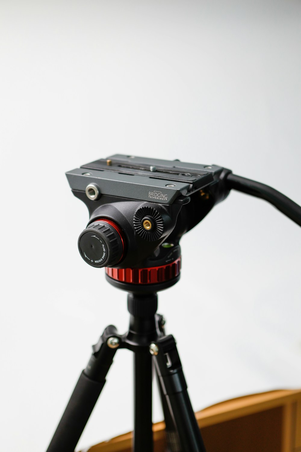a tripod with a camera attached to it