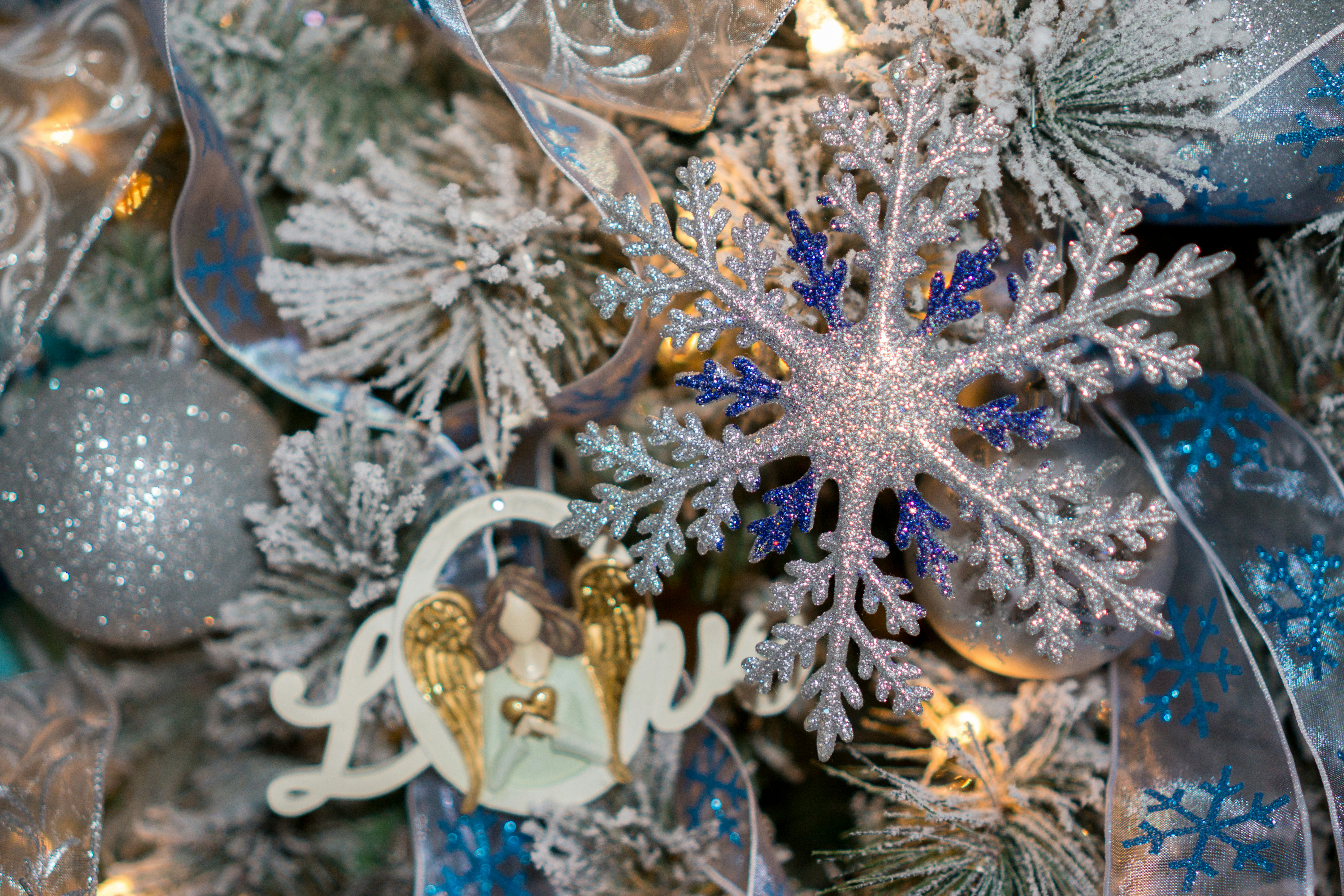 a close up of a christmas tree with ornaments