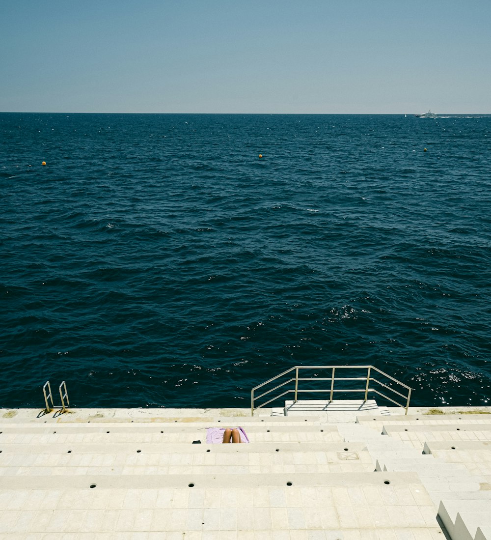 a view of the ocean from the top of a building