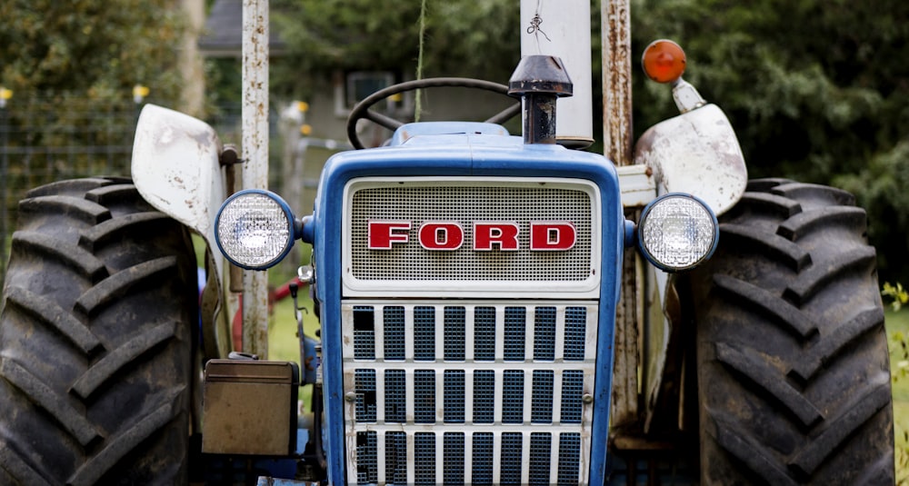 a blue tractor with the word ford on the front