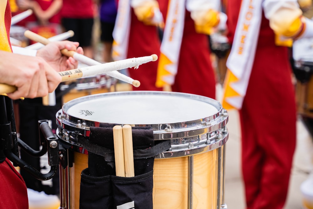 a group of people playing drums in a parade