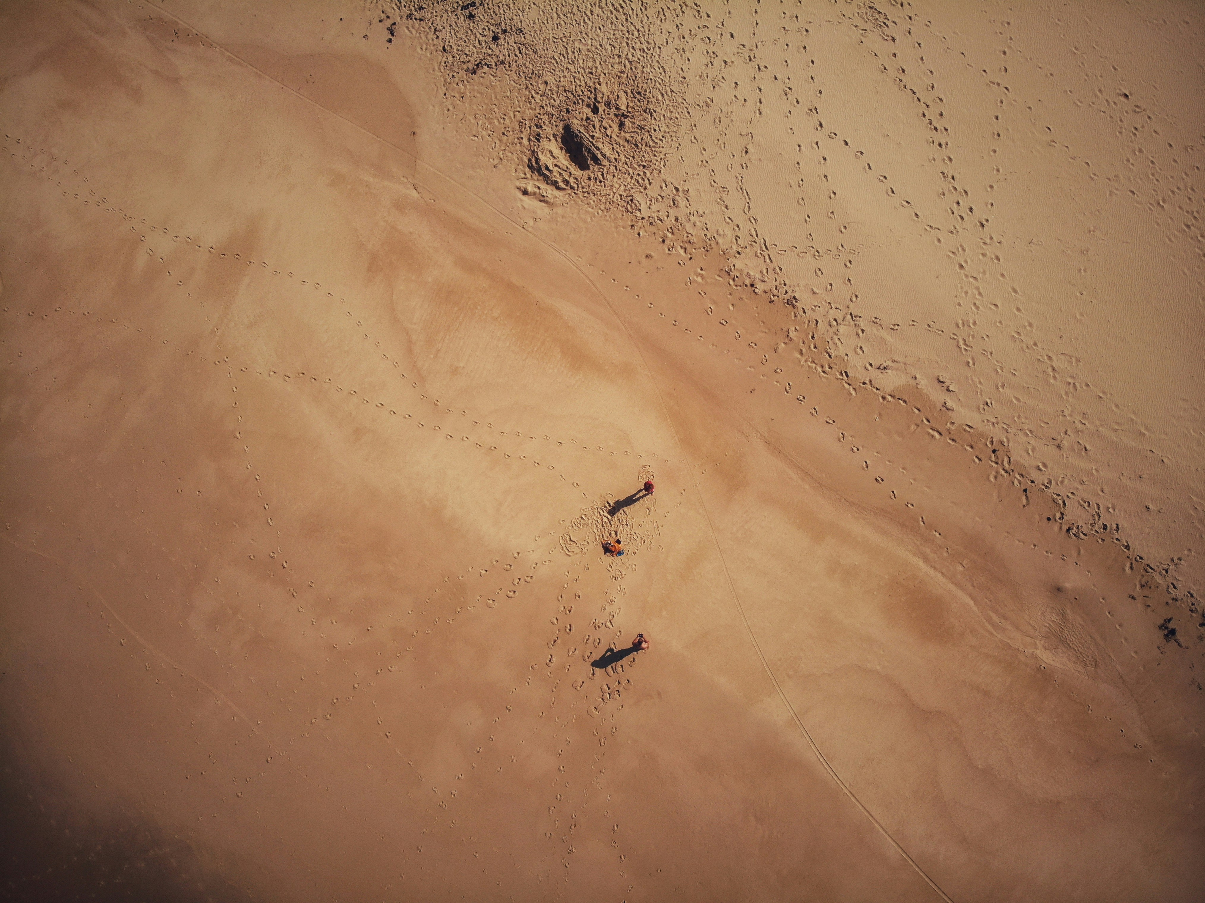 Space-suited engineer inspecting drilling equipment