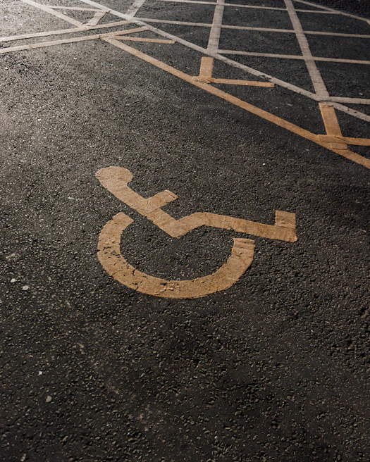 Close-up of a parking space with crisp, clean striping and a handicap symbol clearly visible