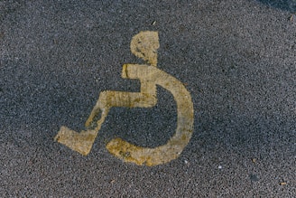 a handicapped sign is painted on the pavement