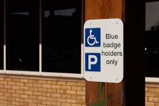 a blue and white sign that says blue baggage holders only