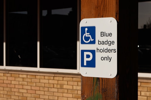 a blue and white sign that says blue baggage holders only