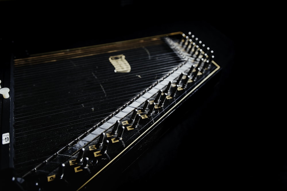 a close up of a musical instrument in the dark