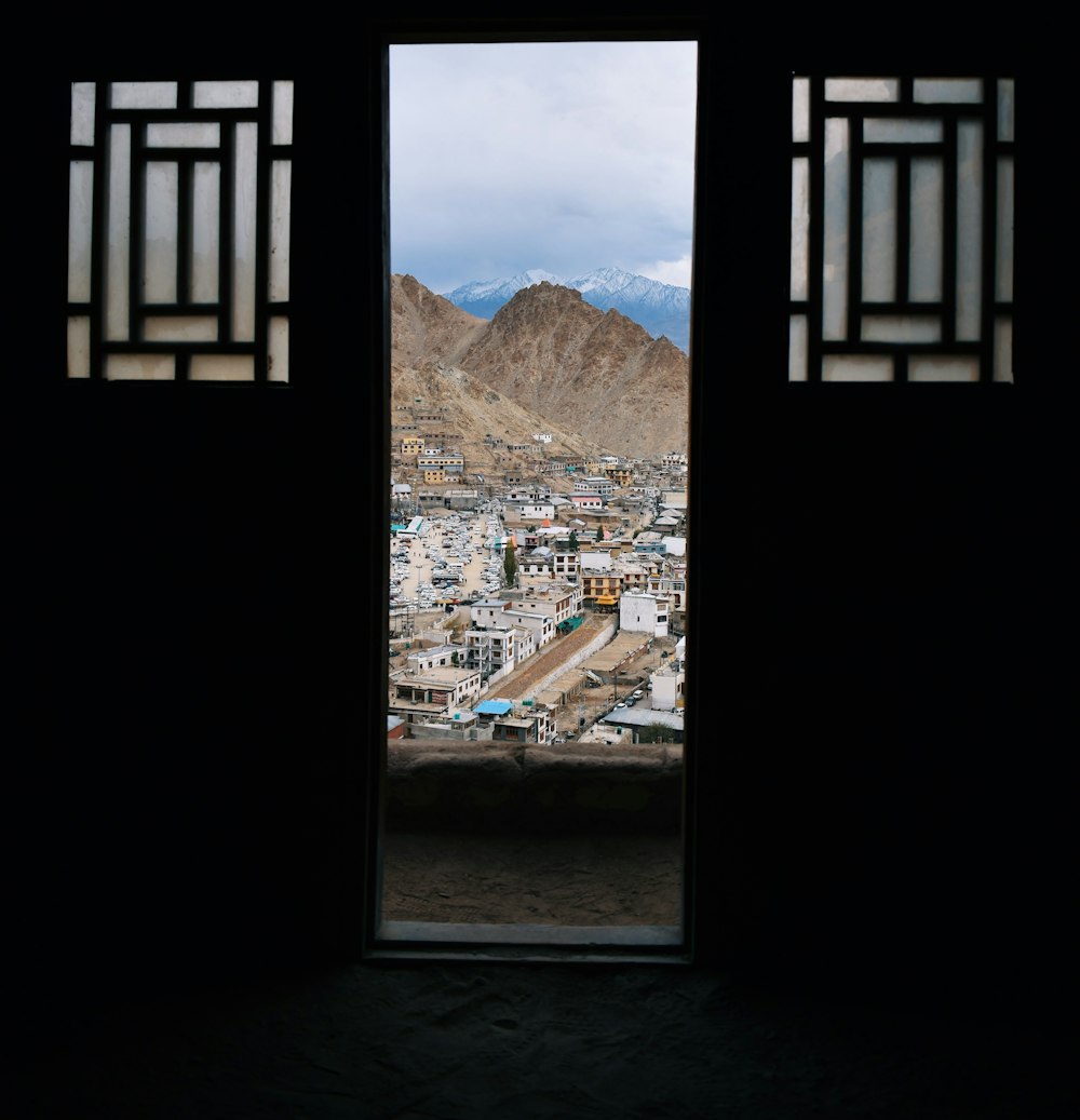 a view of a city from a window in a building