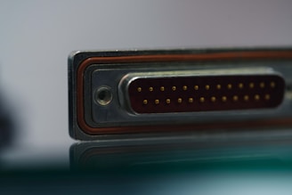 a close up of a metal object with a reflection on the surface