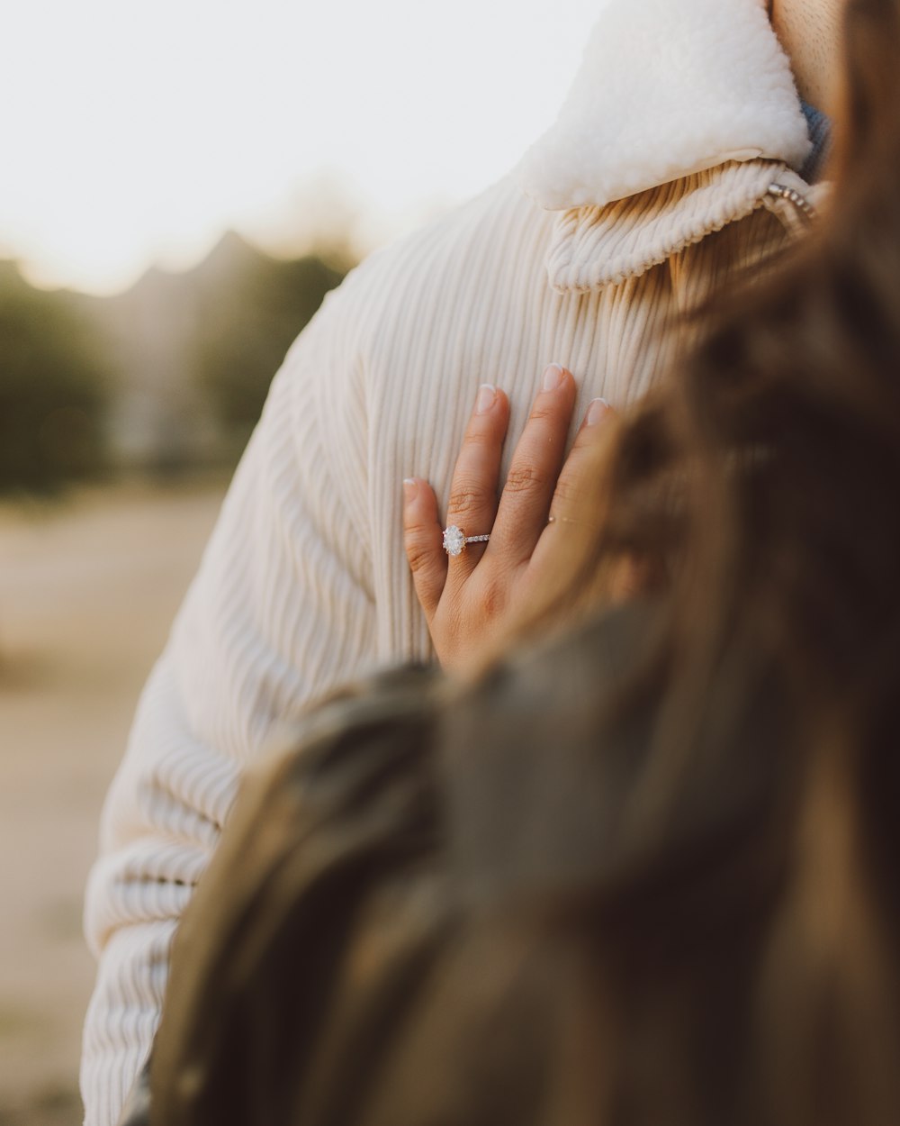 a close up of a person wearing a ring