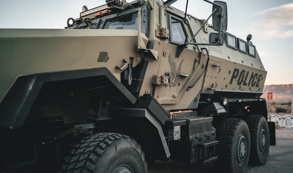 a large military vehicle parked in a parking lot