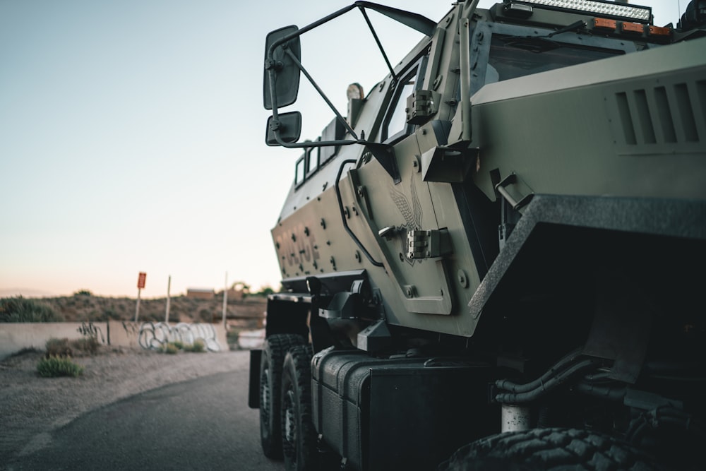 a military truck parked on the side of the road