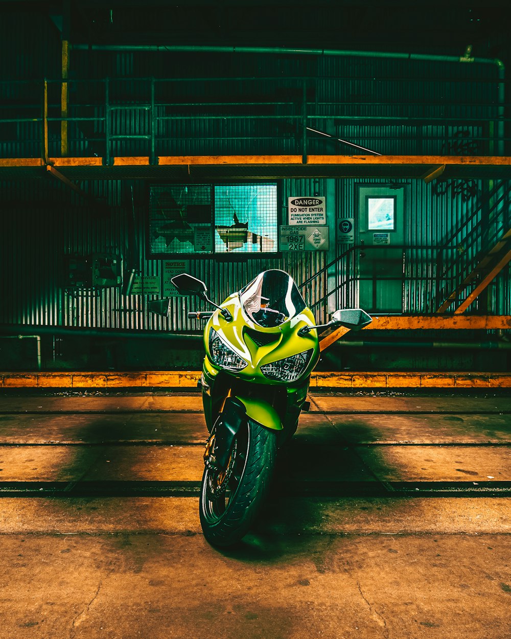 a yellow motorcycle parked in a parking lot