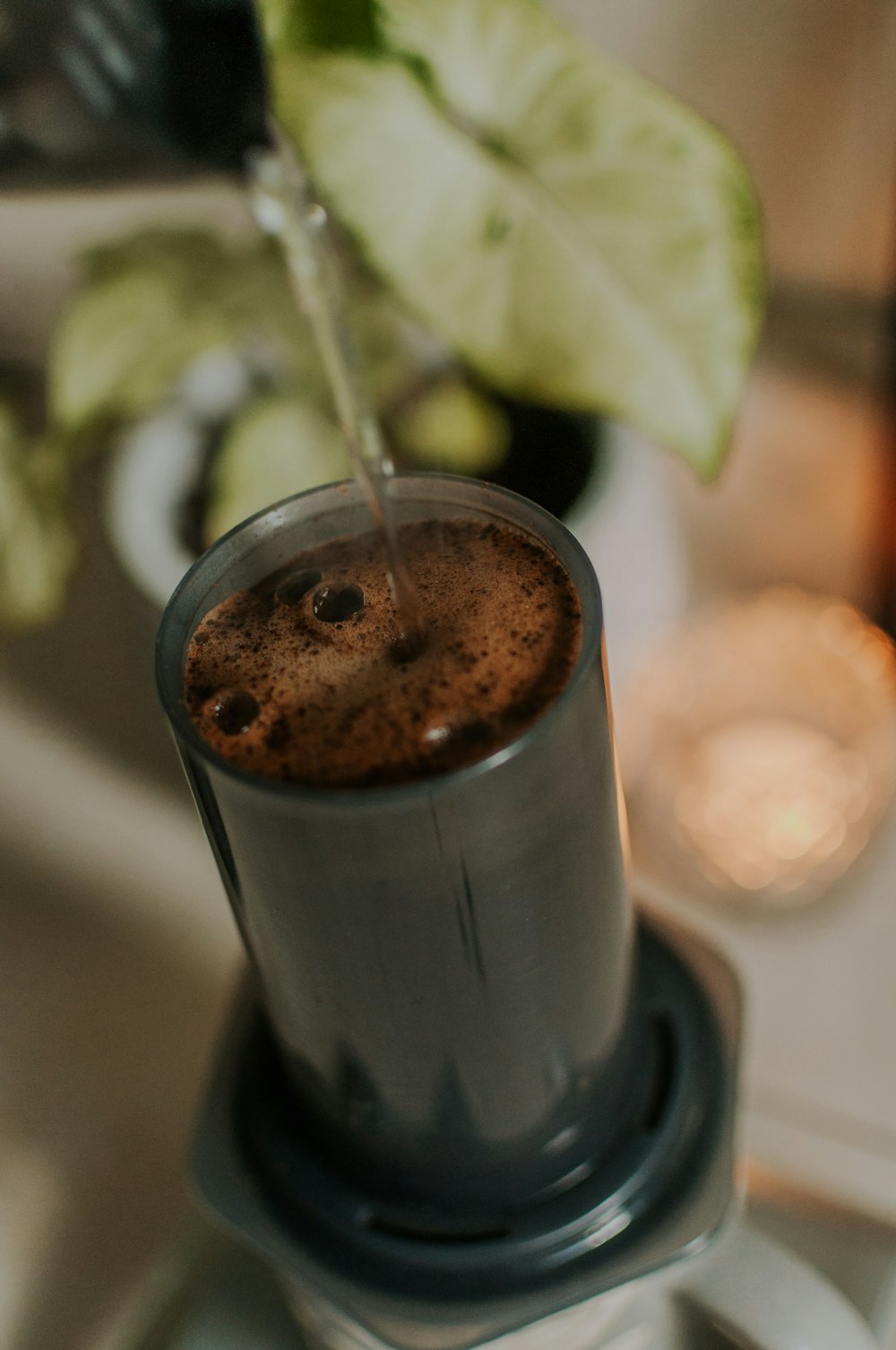 a close up of a blender with a drink in it