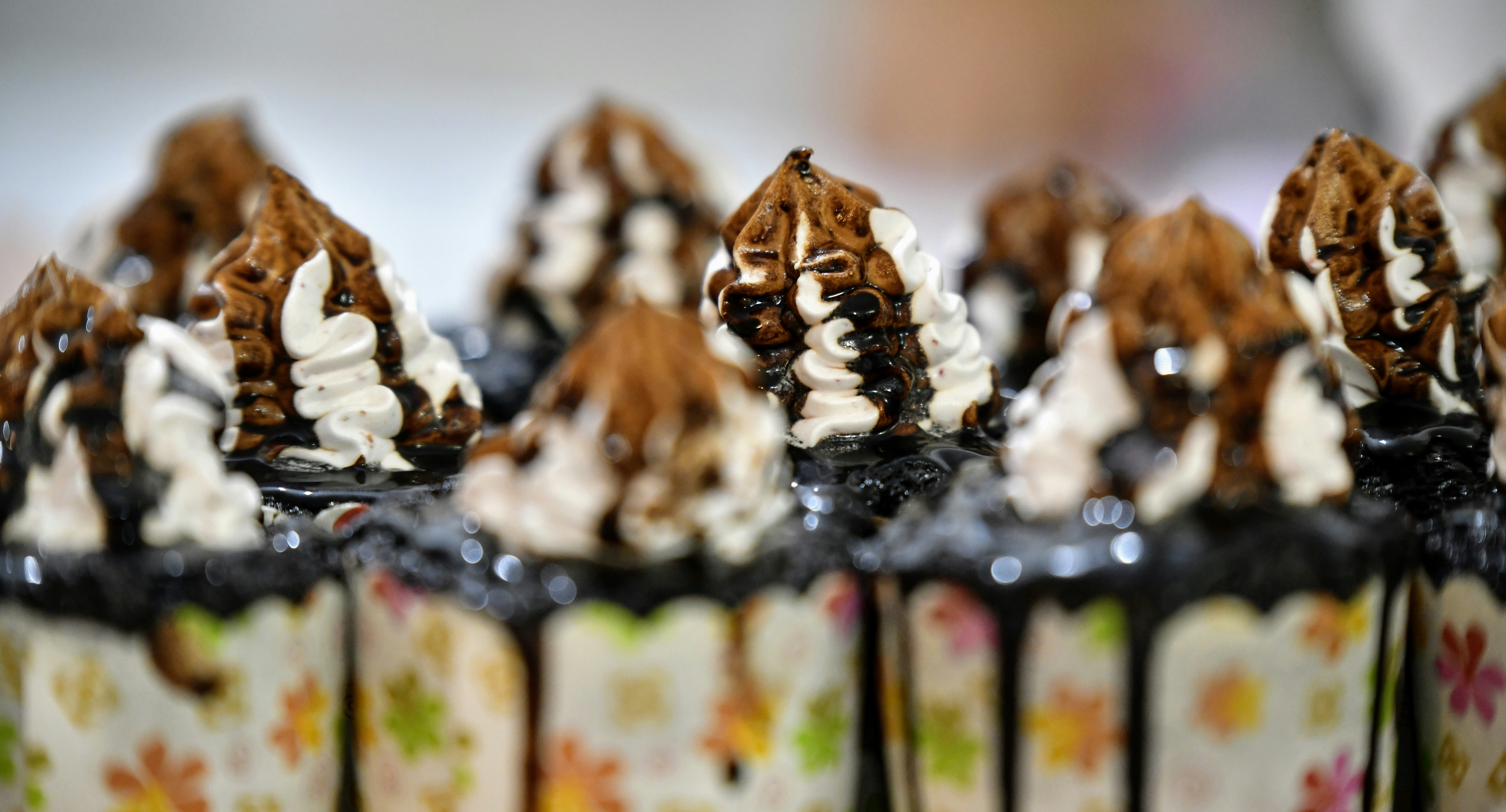 a close up of a cupcake with chocolate and white frosting