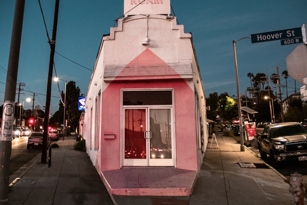 a pink building with a clock tower on top of it