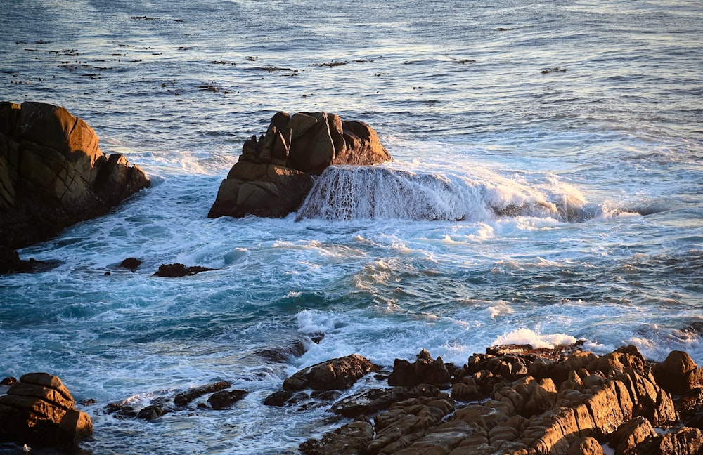 a large body of water surrounded by rocks