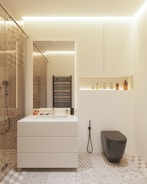 Heated tile floor glowing softly beneath a modern bathroom setup.