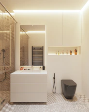 a bathroom with a sink, toilet, and shower
