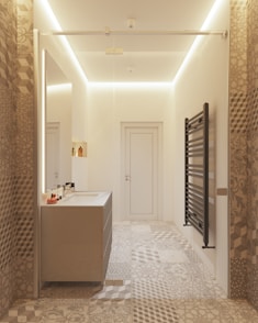 a bathroom with a sink, mirror and towel rack
