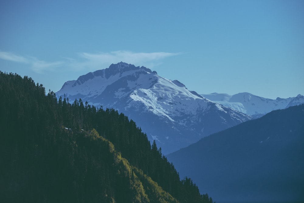 a view of a snow covered mountain from a distance