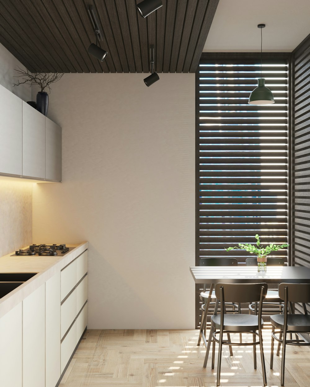 a kitchen with a table and chairs next to a window