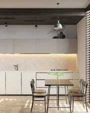 a dining room with a table and chairs