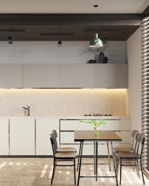 a dining room with a table and chairs