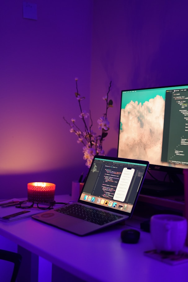 a laptop computer sitting on top of a desk