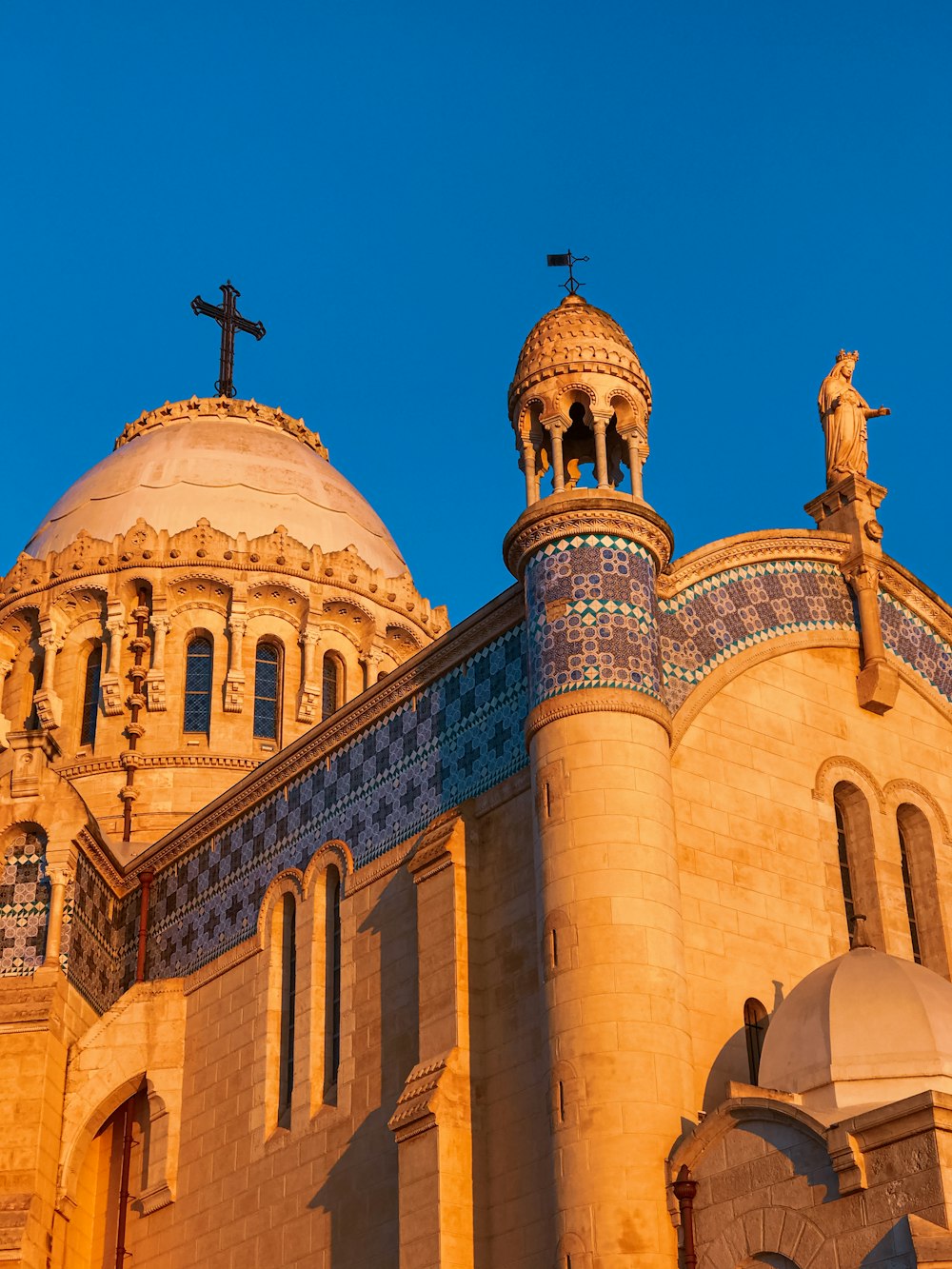 a large building with a cross on top of it