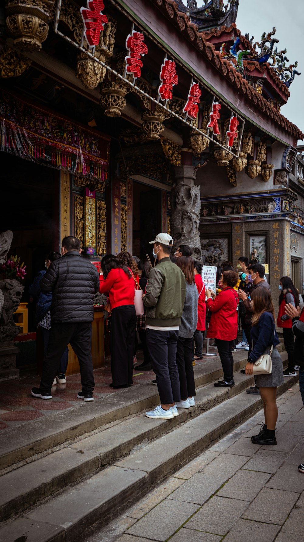 a group of people standing outside of a building