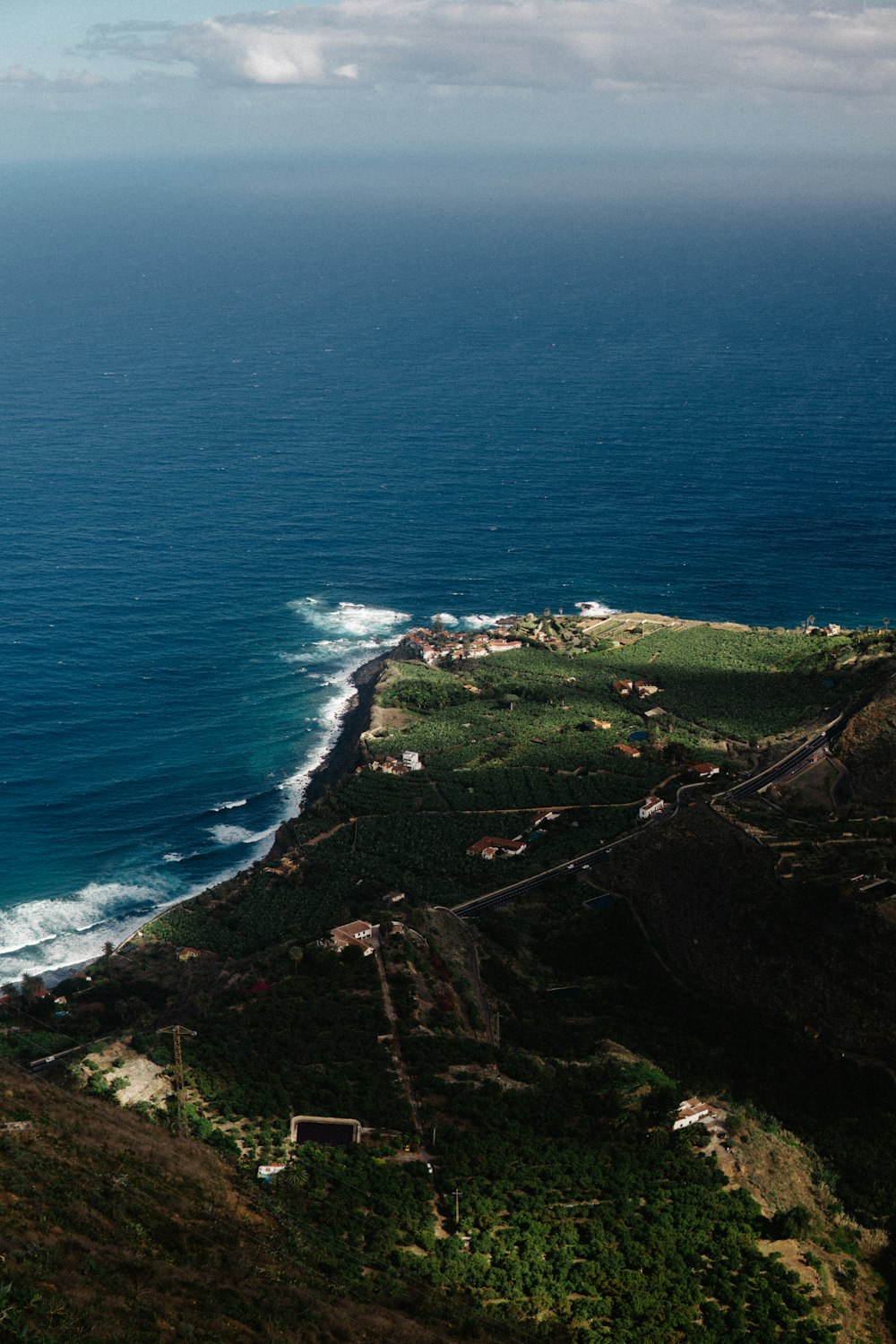 a scenic view of the ocean from a hill