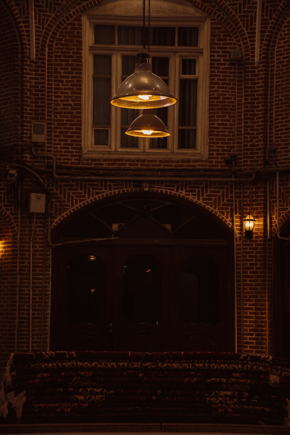 a light hanging from the ceiling of a building