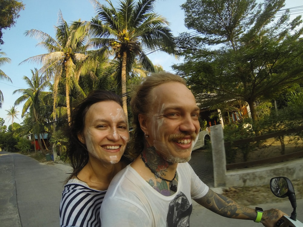 a man and a woman on a scooter