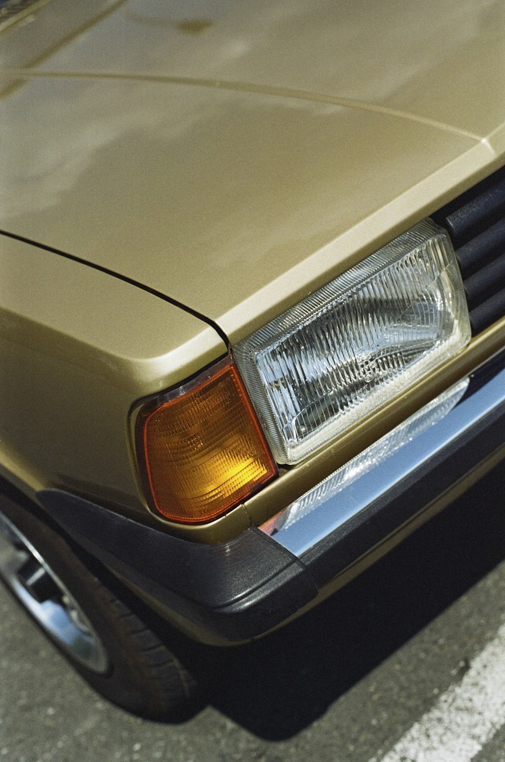 a close up of a car parked in a parking lot