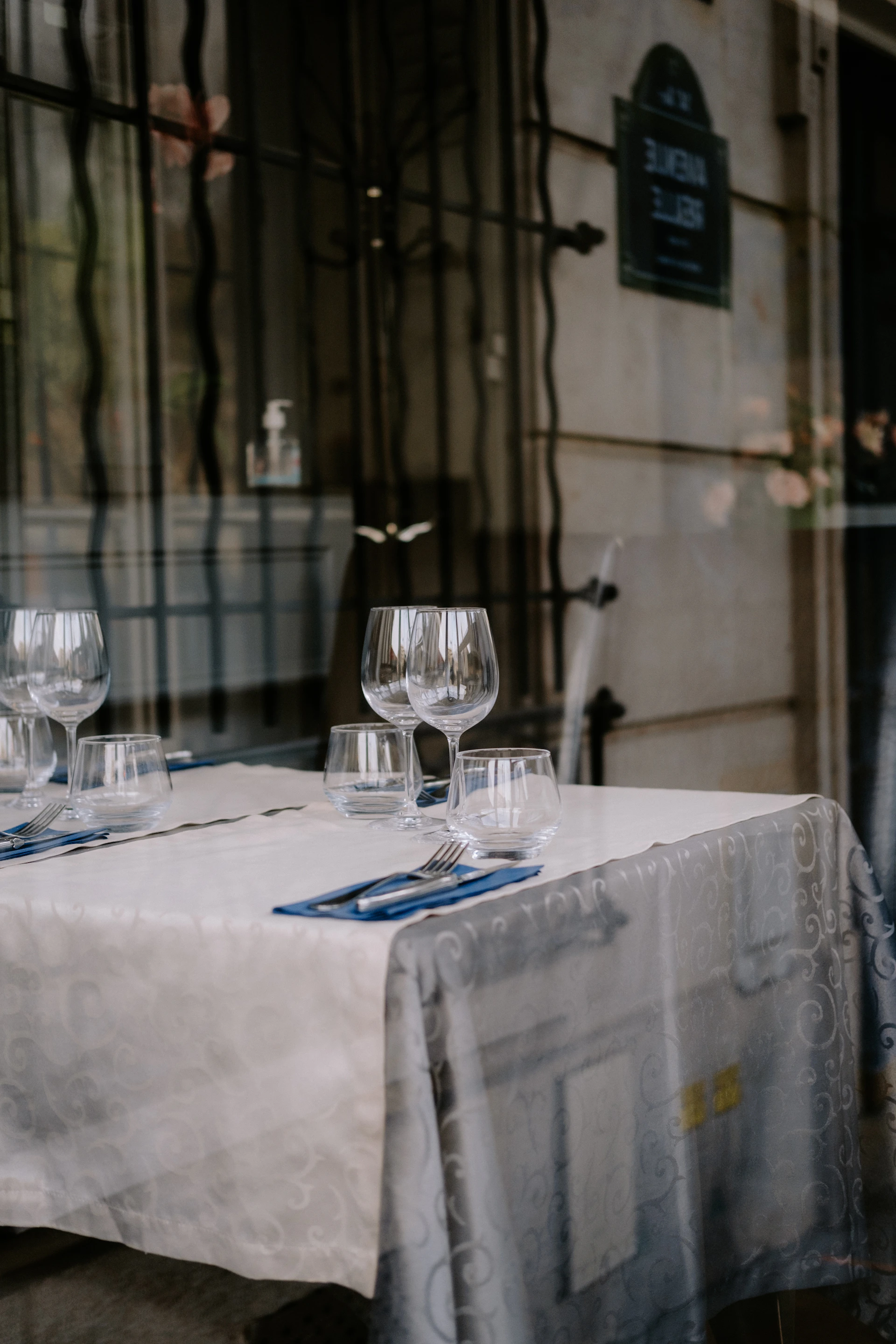 a table with a white table cloth and glasses on it