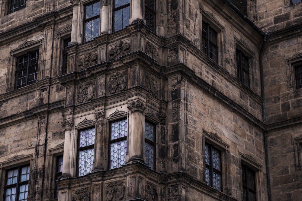 a tall building with lots of windows and a clock